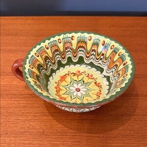traditional Bulgarian redware clay pottery bowl, specifically in the Troyan